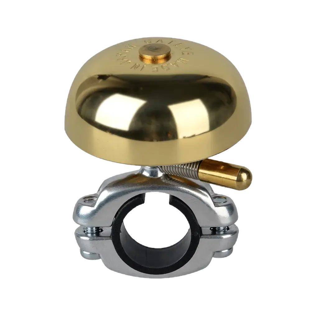 The CATEYE OH-2200 Yamabiko Bell features a shiny brass design with an aluminum die-cast mount for secure handlebar attachment and a small lever for easy ringing.