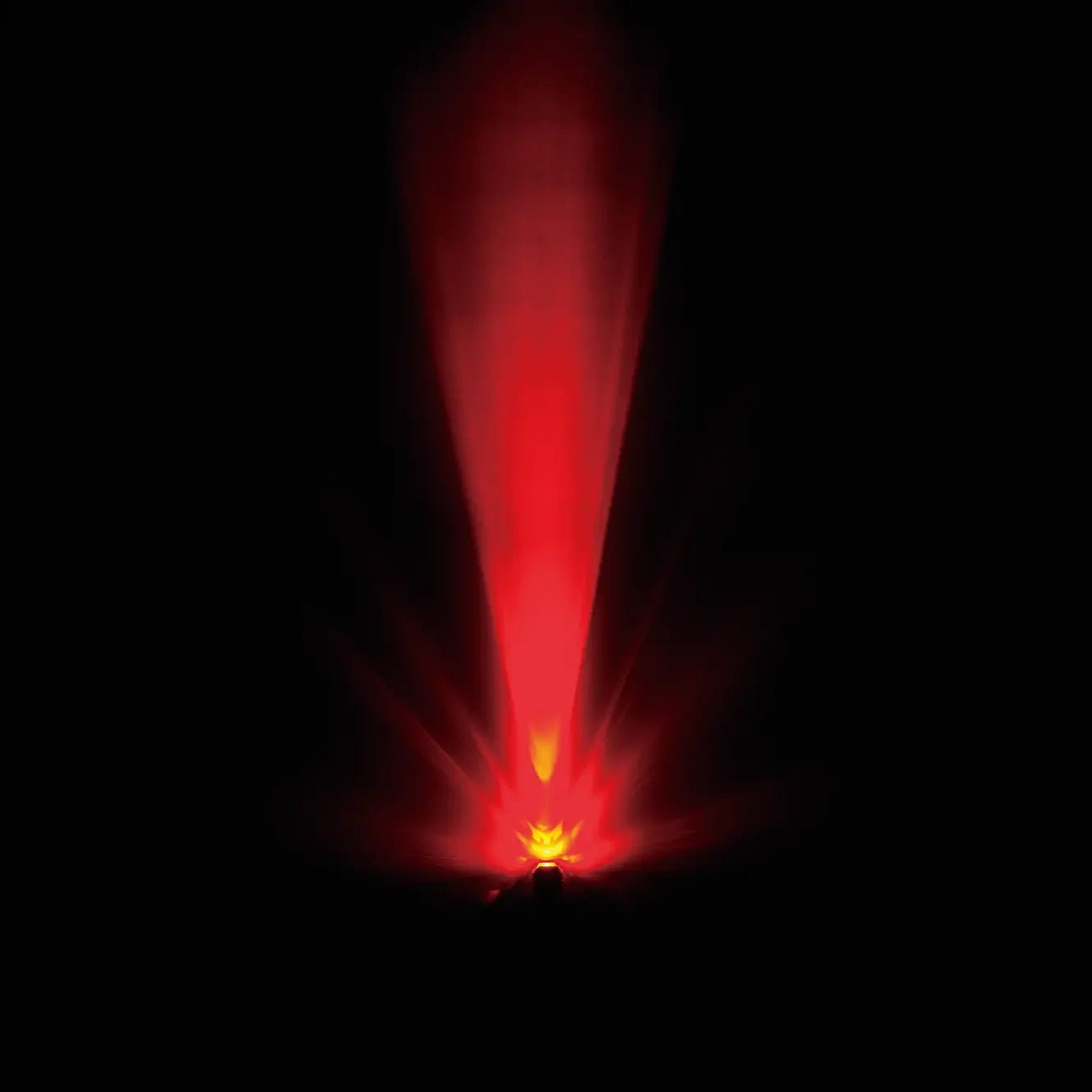The CATEYE ORB emits vibrant red light upward like a safety beacon, creating a striking, radiant effect against the darkness.
