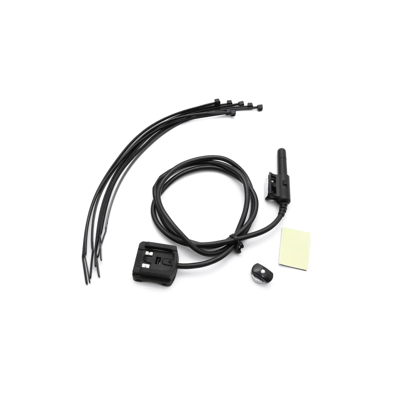 The CATEYE Enduro Parts Kit includes a wireless sensor with black cable, universal wheel magnet, compact receiver, four zip ties, and adhesive pad—perfect for installing the Enduro Parts Kit on any setup.