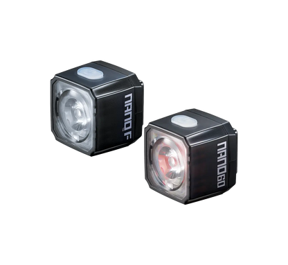 Two small, black, cube-shaped bike lights—the CATEYE NANO100 F for white light and NANO60 for red—feature USB-C charging, a top button, and "Nanob" branding on the side.