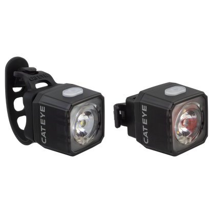 The CATEYE NANO100 F & NANO60 set includes two black, USB-C rechargeable bike lights with square designs, white power buttons, and rubber straps—one front white light and one rear red for enhanced daytime visibility.