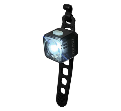 The CATEYE NANO100 F is a compact, square 100-lumen bike light with a black adjustable rubber strap and white glow, designed for handlebars or seat posts—ideal as a daytime safety light to boost your cycling visibility.