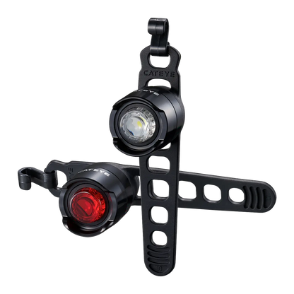 The CATEYE ORB Rechargeable includes two compact round LED bike lights—white and red—with black rubber straps for adjustable mounting, providing enhanced visibility and safety on your ride.